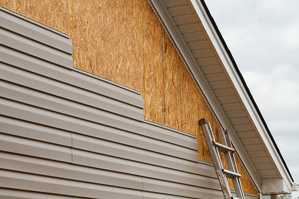 Professional Siding Replacement technician working in East Liberty, OH